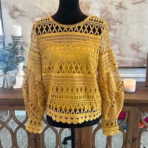 A. Moss lace top in mustard